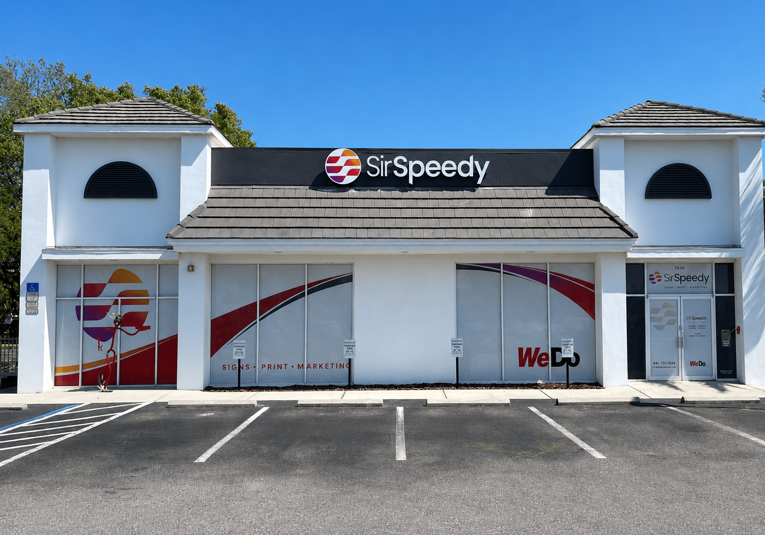 Sir Speedy Sarasota staff celebrating outside of our building.