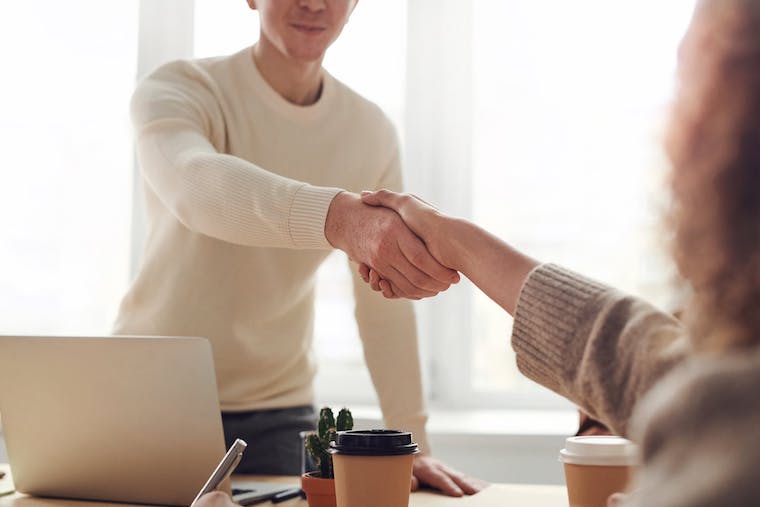 Man shaking hands accepting job