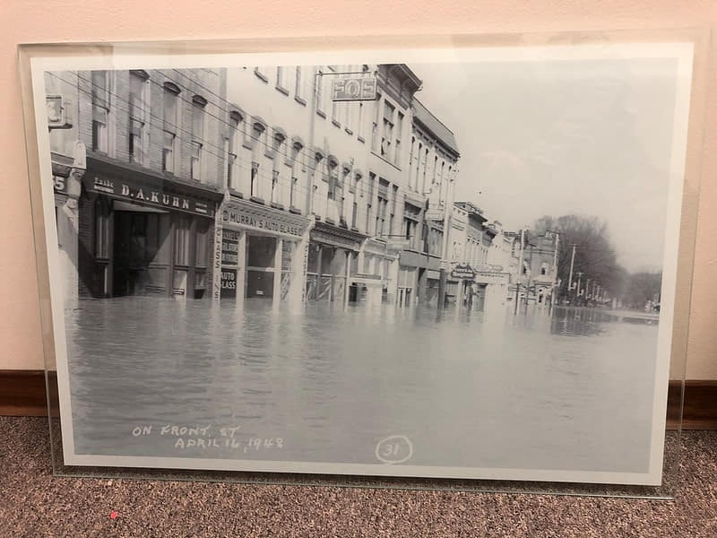 A detailed poster of a flood in a downtown in the 40's