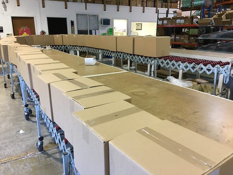 Boxes in a line awaiting being loaded onto a delivery truck