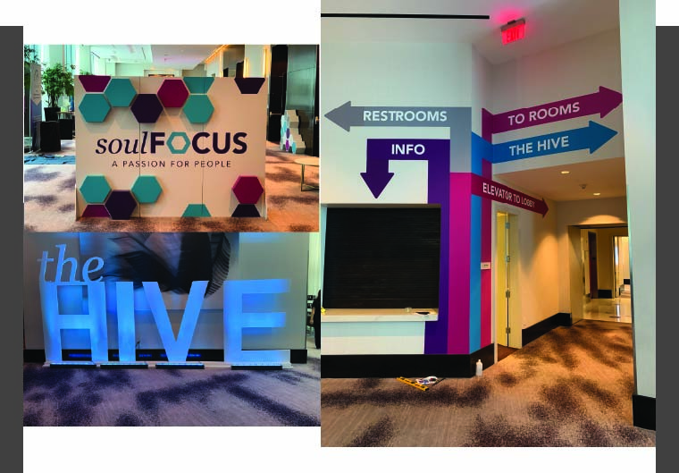 Custom trade show booth with large-format graphics, colorful shelving, and high-impact branded visuals designed to attract attention and showcase products.