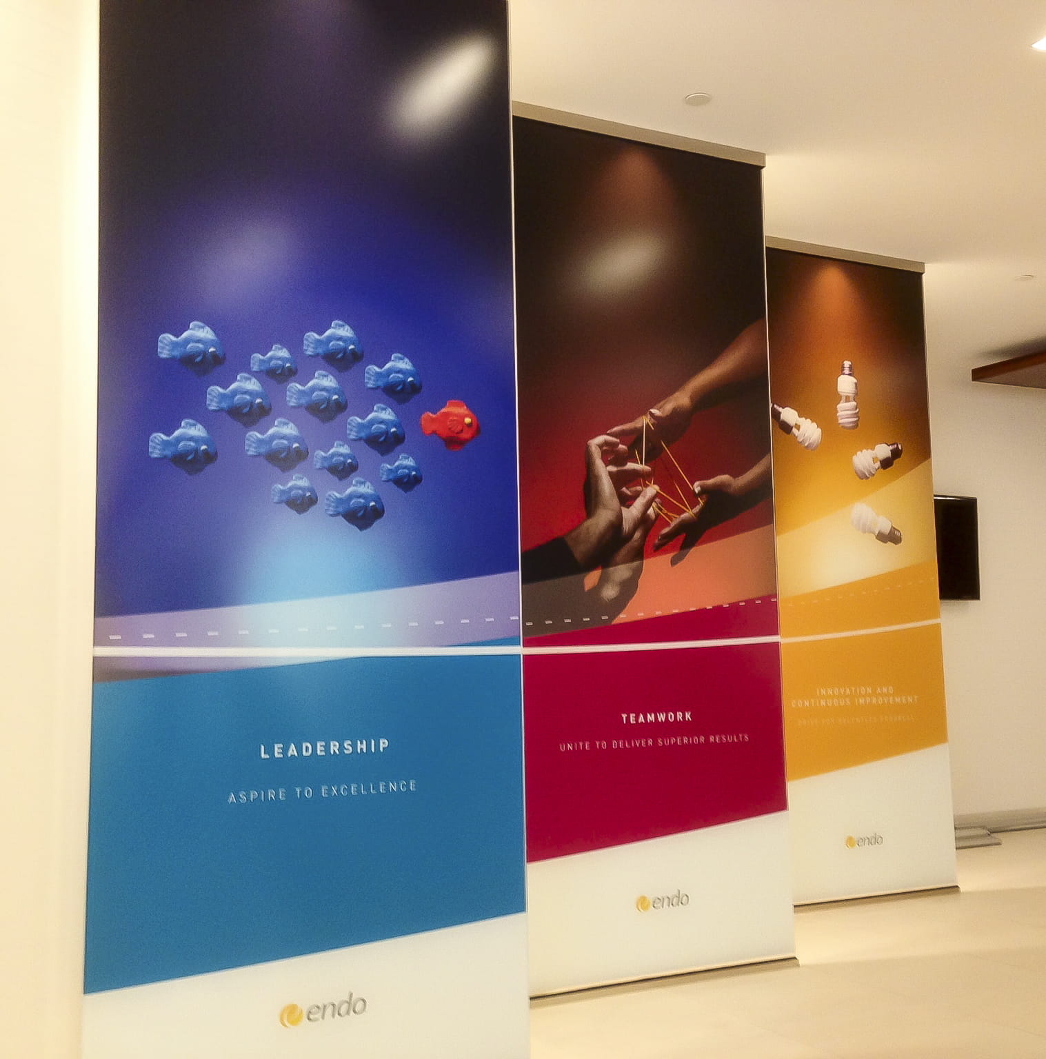 Three colourful pull-up banners.